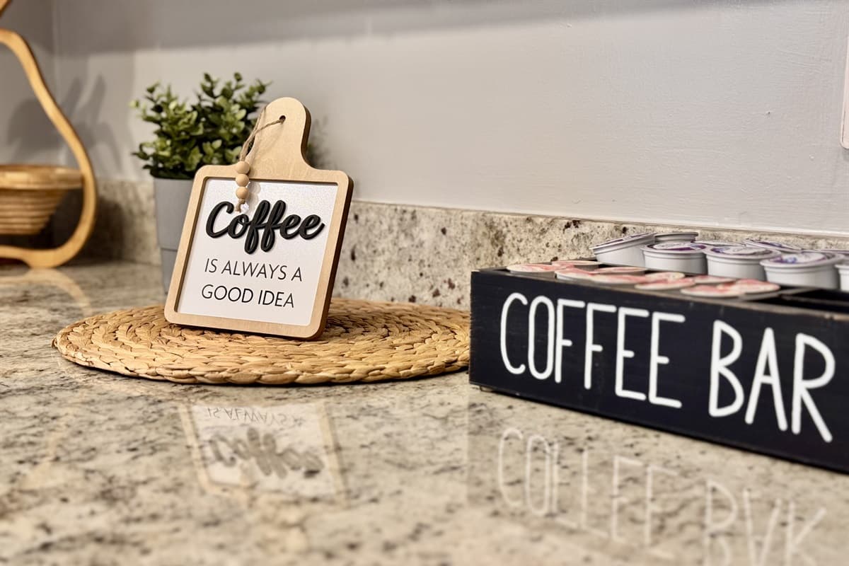 ☕ Good morning, vacation! The charming coffee bar is fully set up with mugs, a coffee maker, and everything you need to start your day right. Because coffee is ALWAYS a good idea! ☀️💛