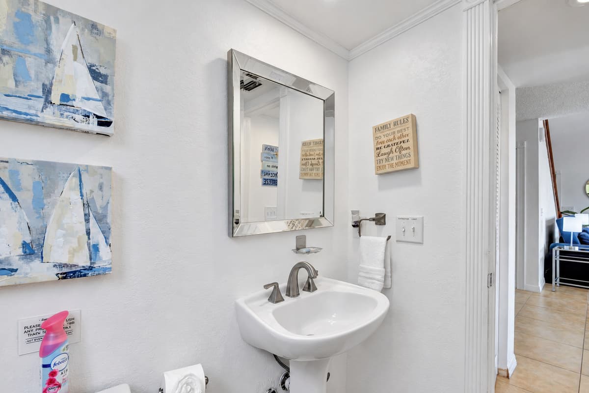 The bathroom features a sleek and modern design, with clean lines and high-quality finishes that create a pleasant and inviting atmosphere.