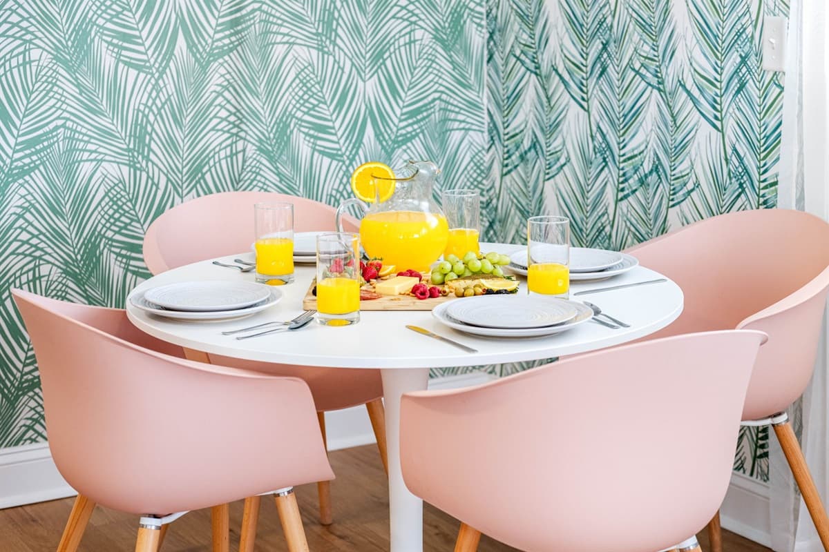 The table, a centerpiece of modern design, invites intimate conversations and shared laughter as you savor delectable bites.
