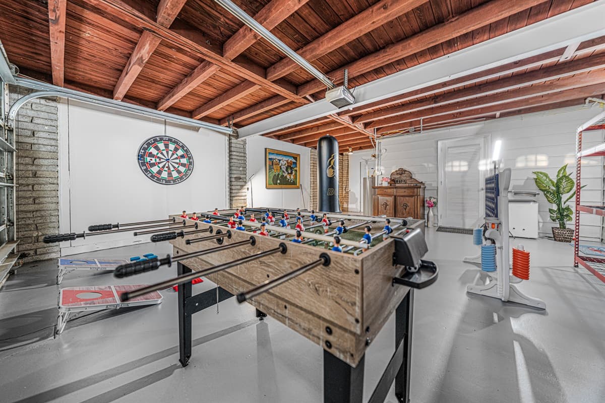 This expansive game room is built for fun, featuring multiple games and plenty of space for friendly competition and group entertainment.