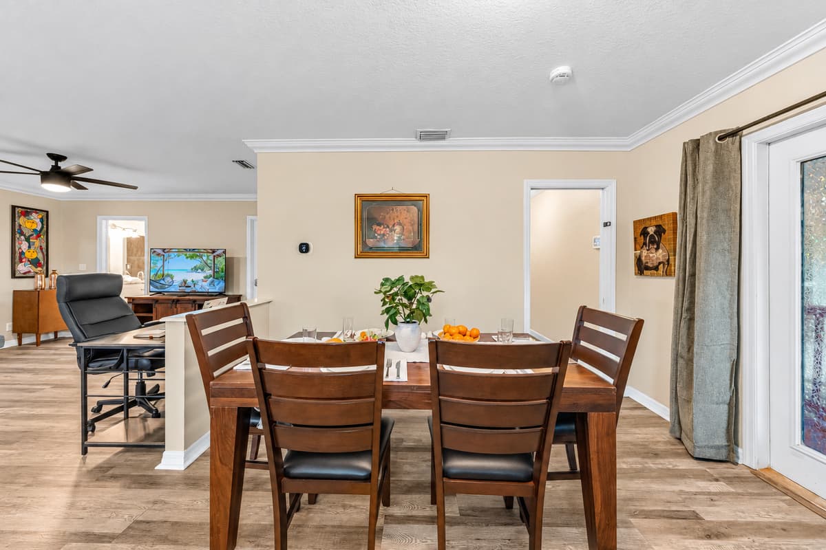 Open dining space flowing into the living room, creating a warm and social atmosphere.