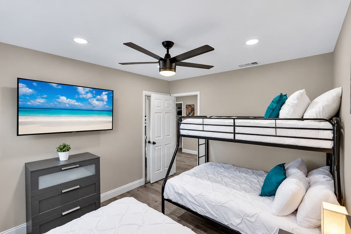 Amazing bedroom with single over twin bunkbed, queen sized bed, closets for storage and smart TV. Great room for families with kids or group of friends.