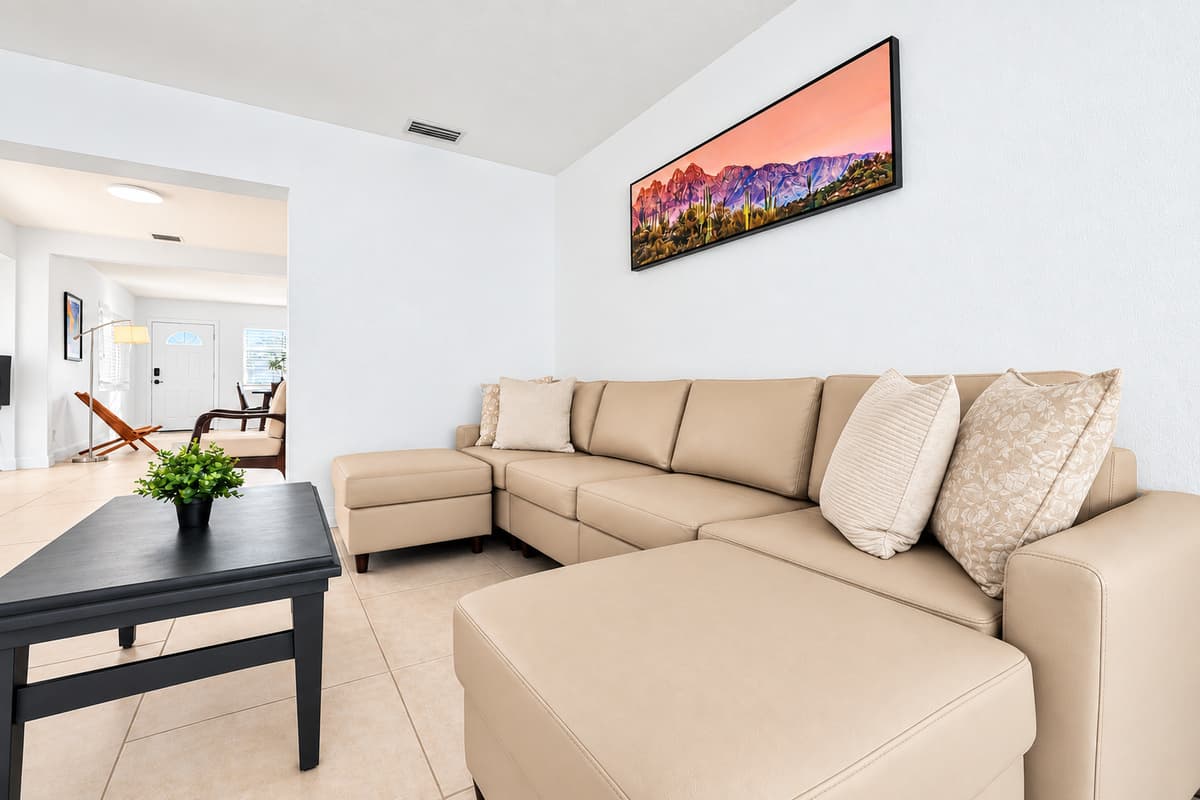 Stylish lounge space featuring plush sectional seating and bright contemporary design.