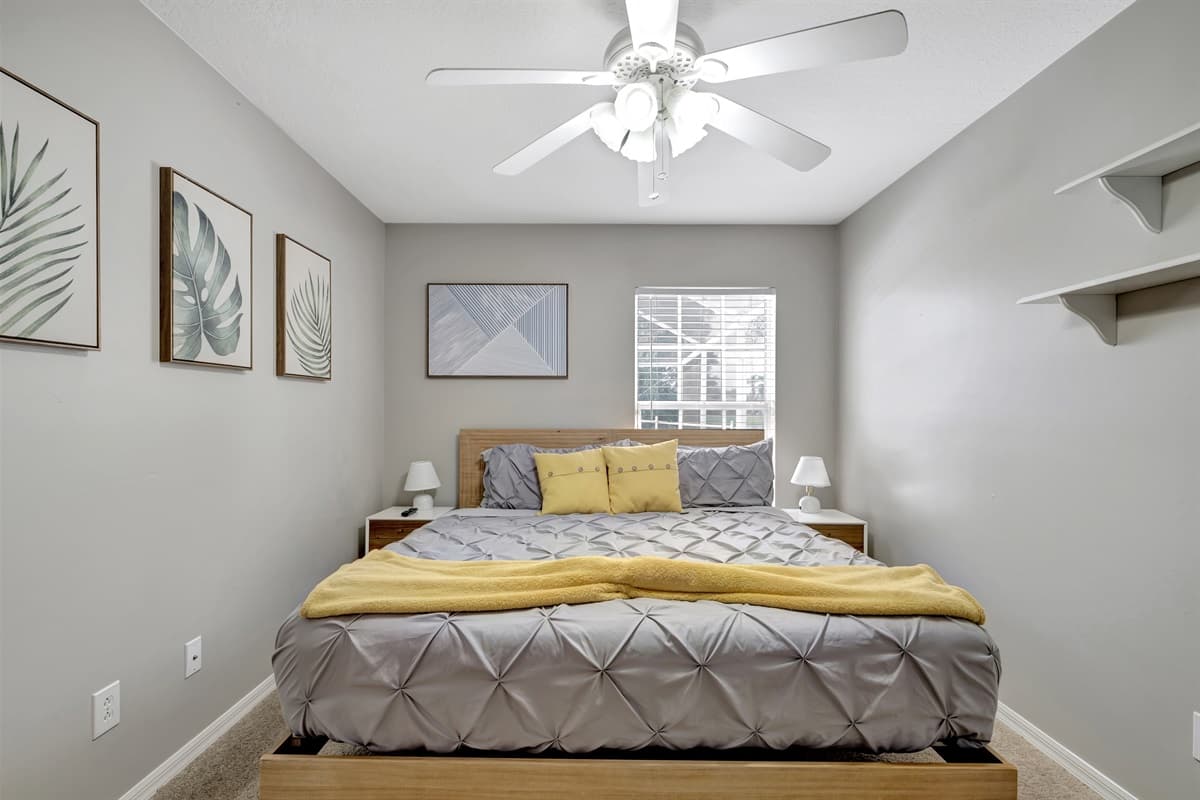 As natural light pours in through the expansive window, the room is bathed in a warm and inviting glow, creating a serene atmosphere. Rest and unwind in style, surrounded by elegance and tranquility in this exquisite queen size bedroom.