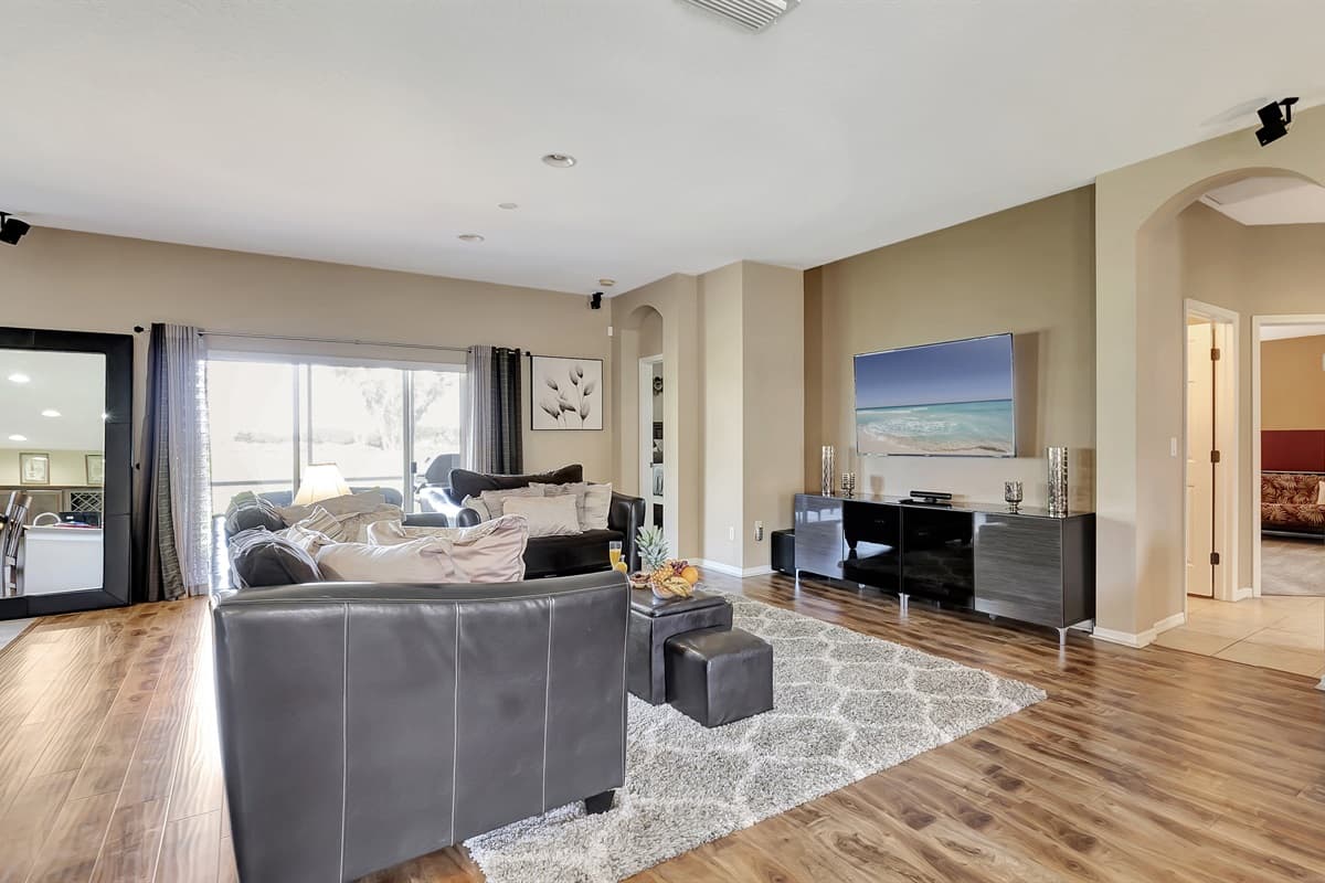 Oversized windows usher in natural light, framing the outside world like living works of art.