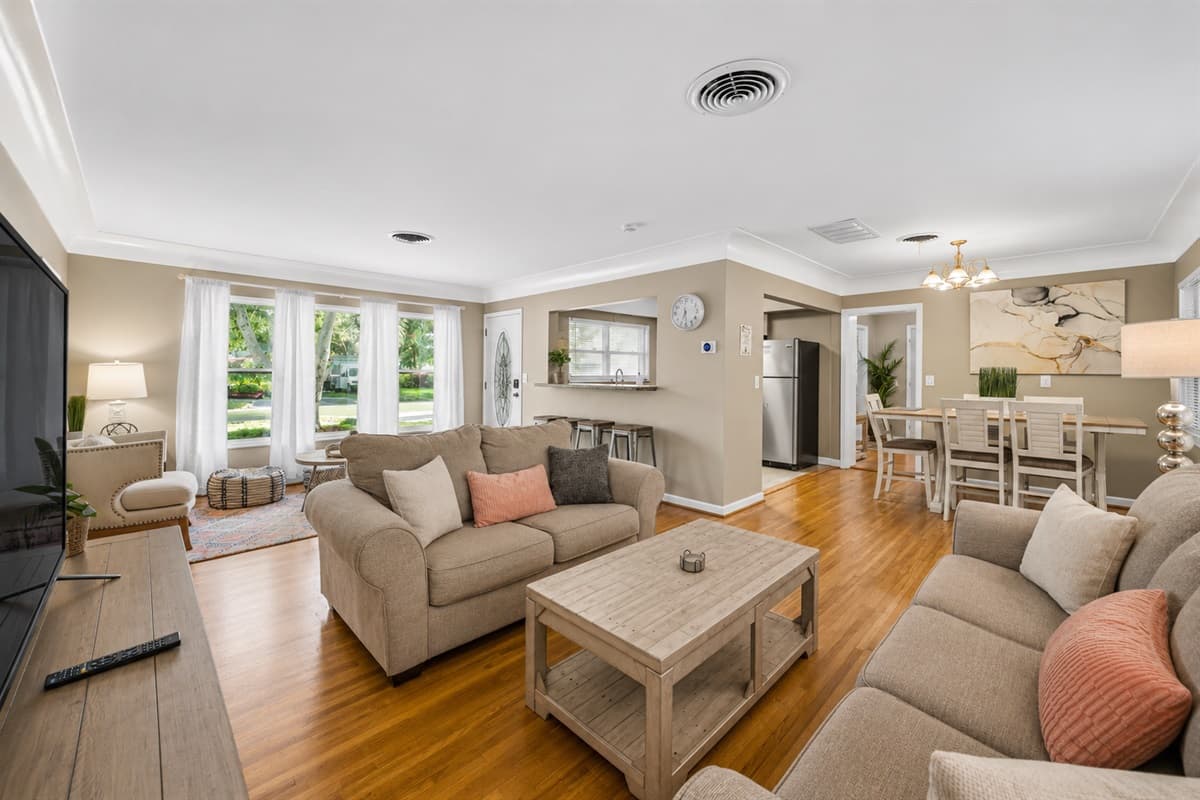 Inviting family room with modern furnishings and a seamless flow into the kitchen and dining spaces.