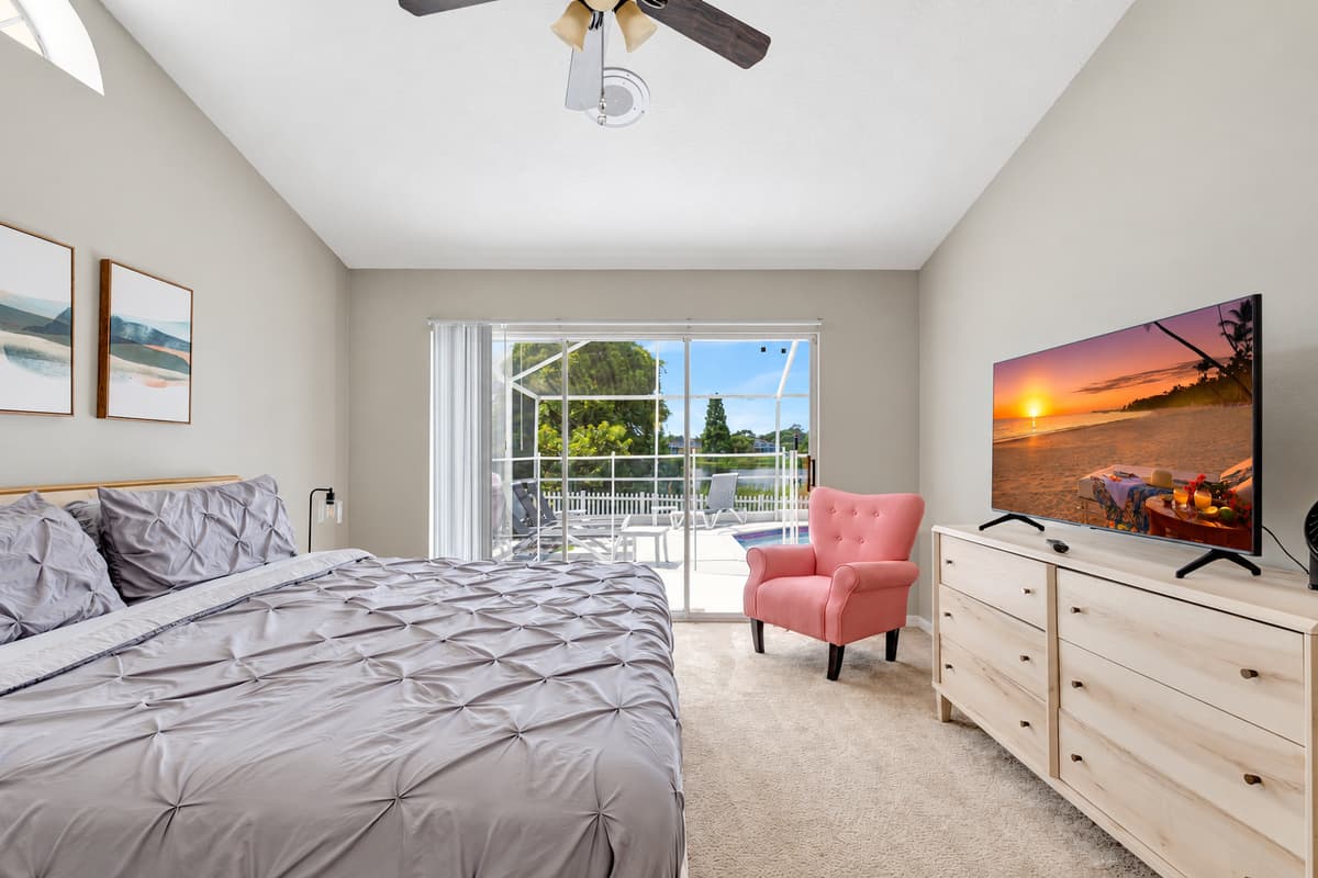 Open the sliding doors, and you'll be greeted by a breathtaking view of the pool, inviting you to take a refreshing dip or simply bask in the serenity of the outdoor oasis.
