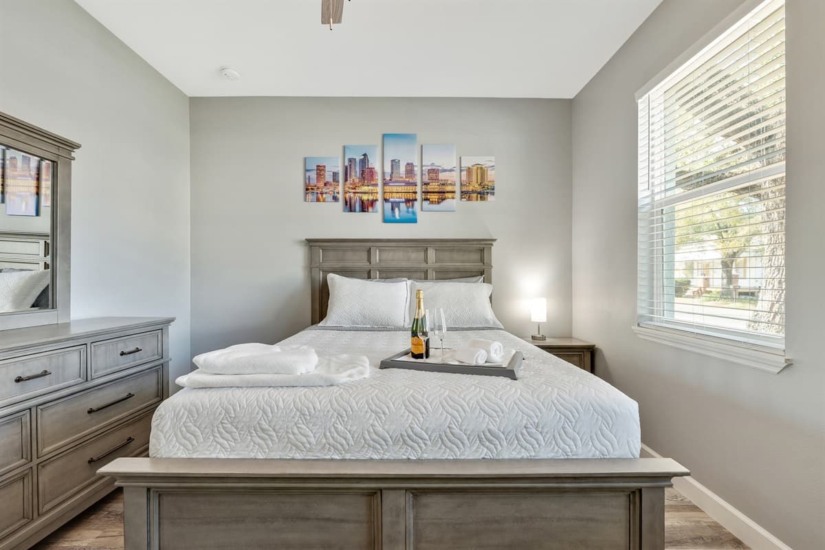 This bedroom exudes a warm and inviting atmosphere that invites you to settle in and make yourself at home.