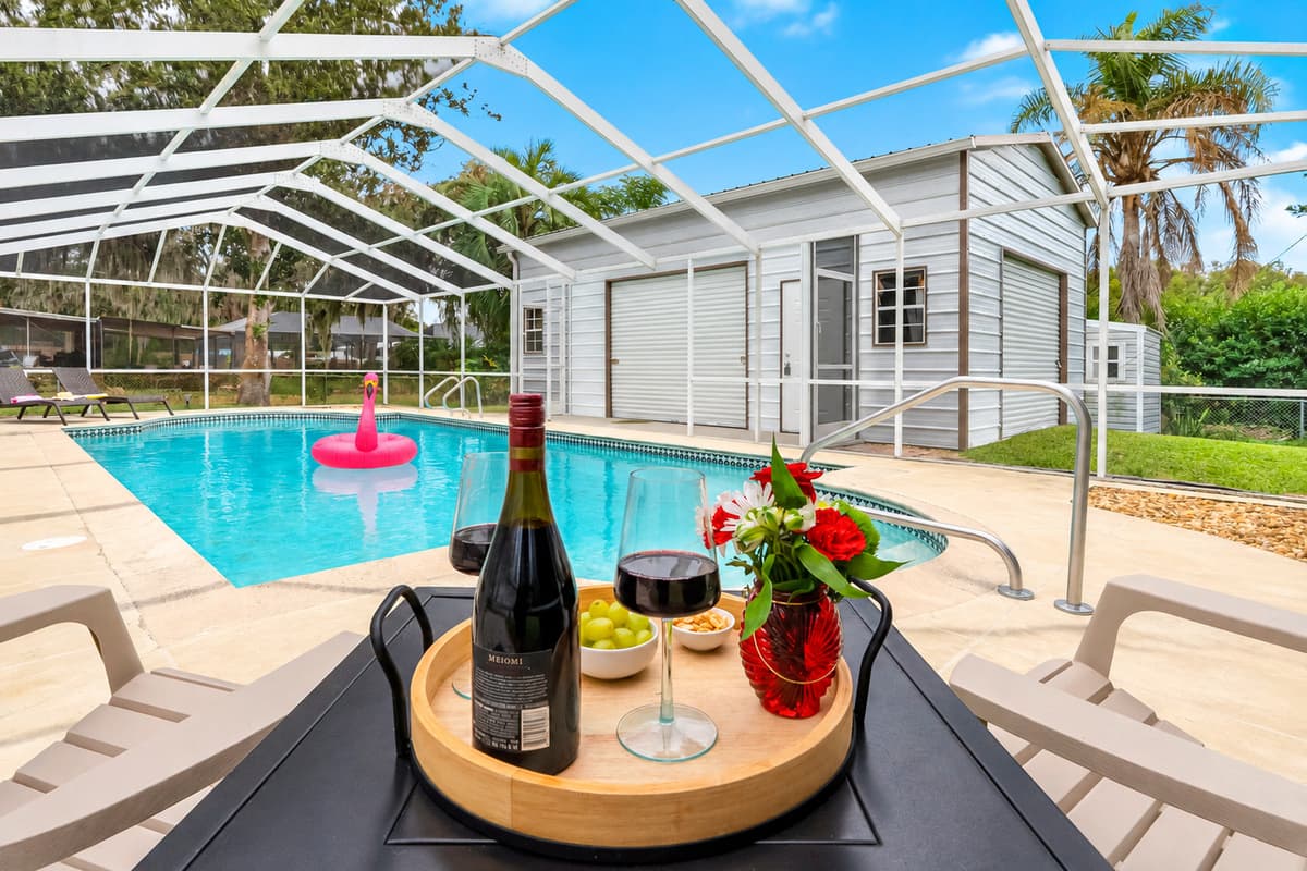 Enjoy a clean, refreshing pool enclosed in a screened patio for added comfort and privacy.