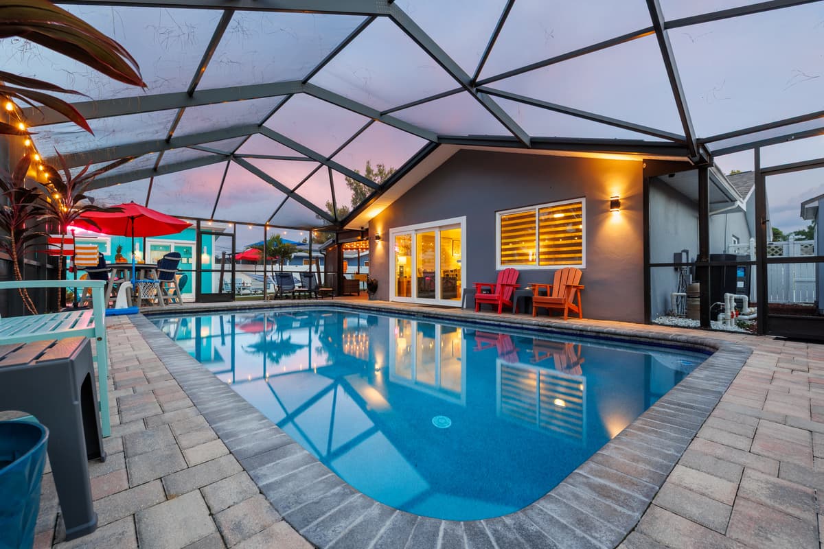 Twilight at the screened-in pool and patio.