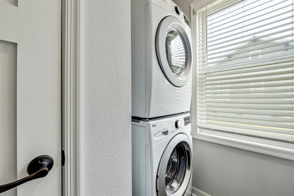 Surrounding the laundry duo are often countertops and workspaces, providing a haven for folding, sorting, and treating stains.