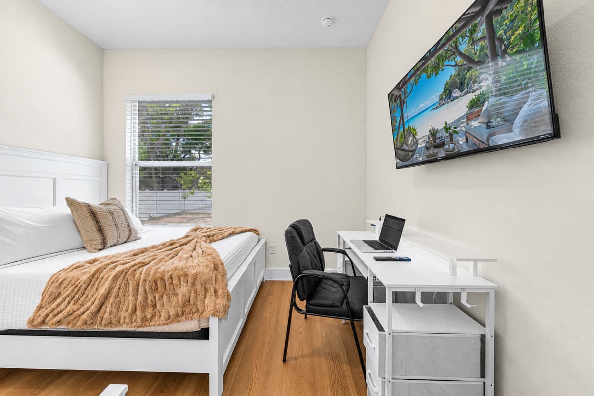 Bedroom 3: queen and twin beds with two desks and a closet; sleeps 3.