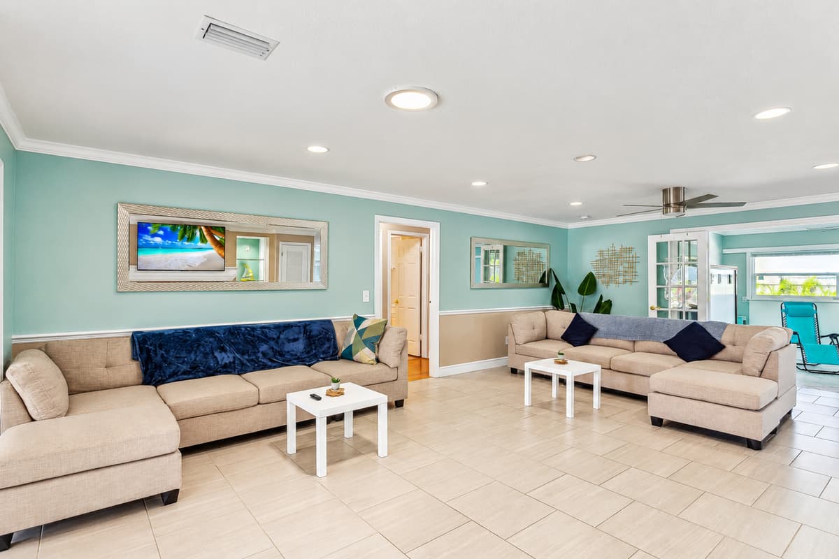 Living room with plenty of seating for the family and large UHD Smart TV
