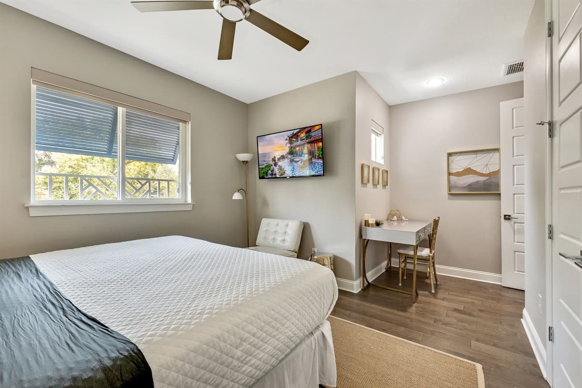 The decor of the bedroom exudes a sophisticated charm, with carefully selected furnishings and tasteful accents that enhance the room's tranquil atmosphere.