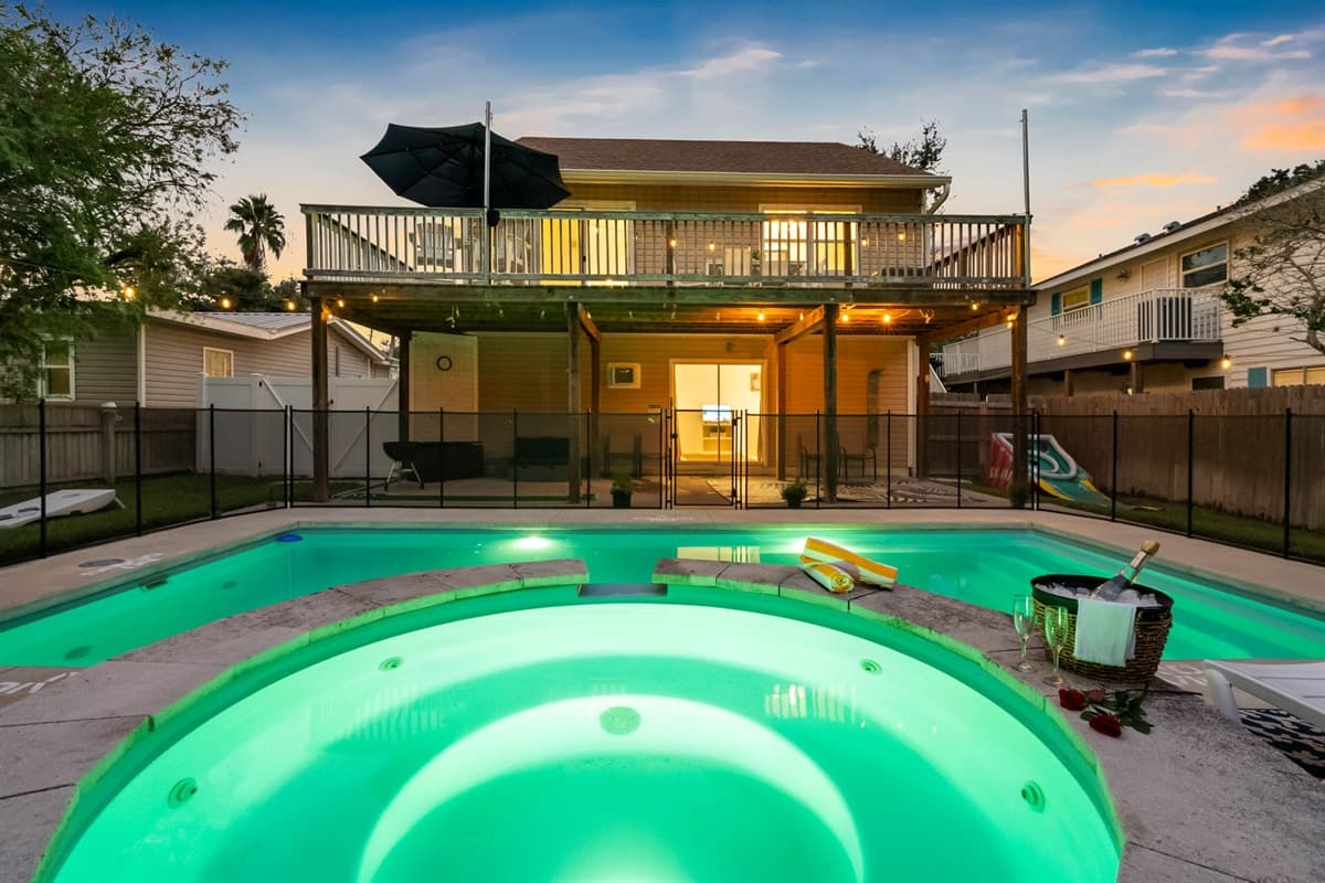 Relax, swim, and unwind in this beautiful outdoor space featuring a clear blue pool, cozy lounge chairs, and plenty of sunshine.
