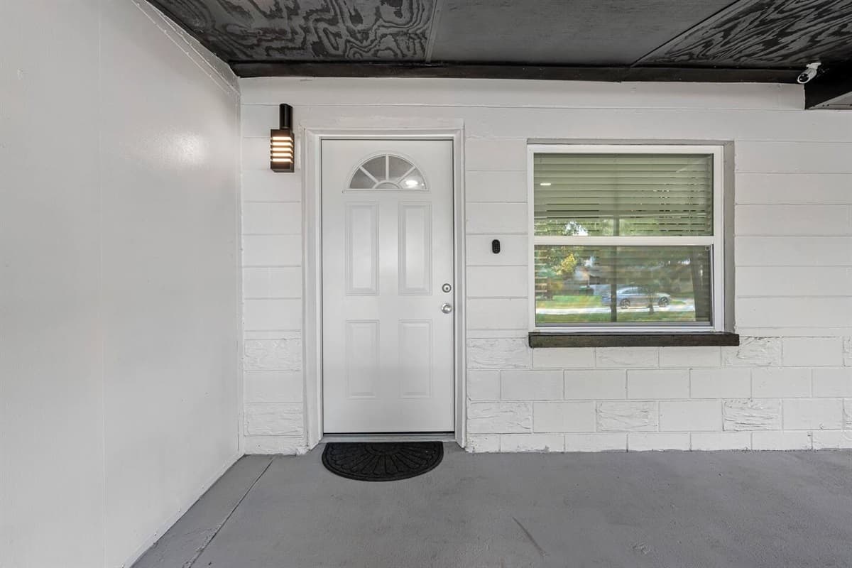 The welcoming front door of the house that leads to the immaculate living area