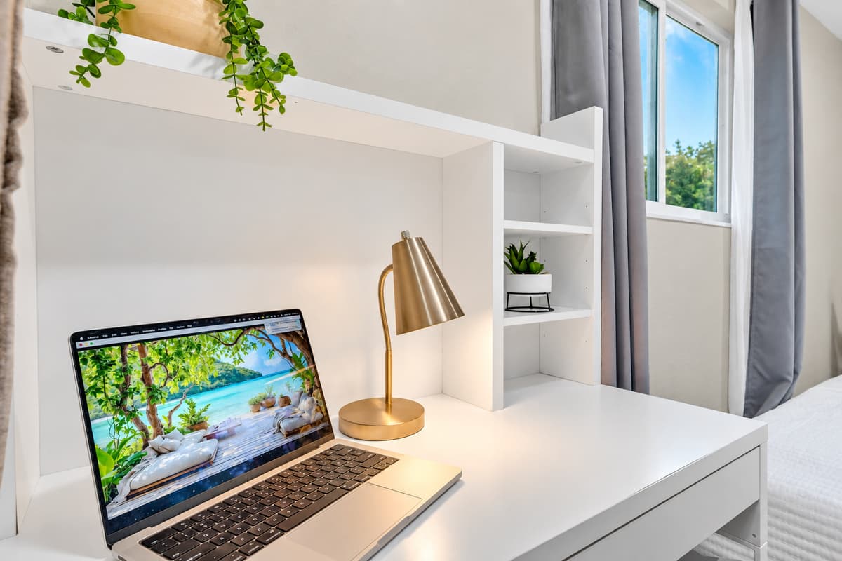 The workspace that keeps the trip from being cancelled. Proper desk, natural light and a chair you can sit in for two hours — one call handled, and the rest of the day belongs to the pool.