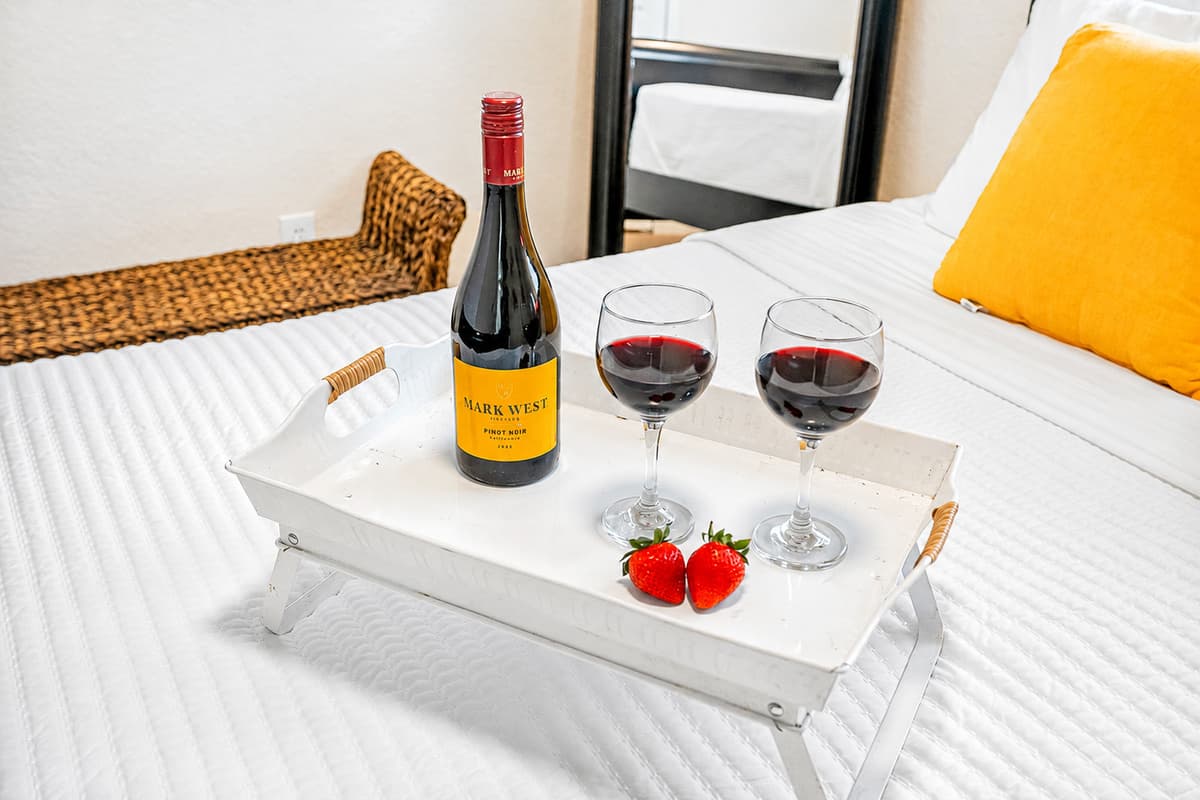 The overall look is minimalist yet warm, perfect for travelers who value a clean, uncluttered space.
