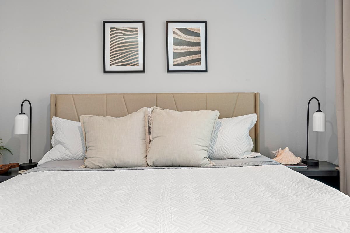 Soft pillows beckon, offering support and solace as you drift off into a restful slumber.