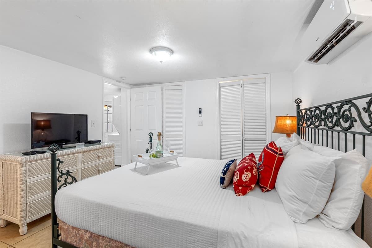 This bedroom is thoughtfully designed with a serene color palette that enhances the room's restful vibe.