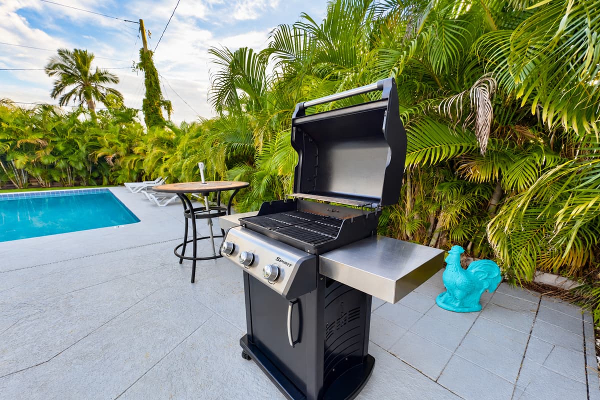 A full-size gas grill and seating area make this backyard the perfect spot for BBQ nights.