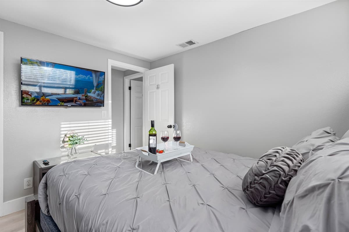 This charming bedroom features a very comfortable queen-size bed and boasts an elegant ambiance.