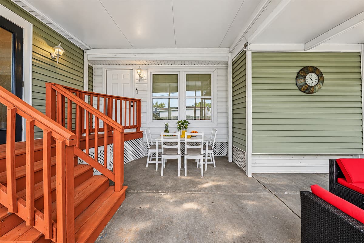 Outdoor dining and lounge area with direct access to the home—ideal for gatherings.