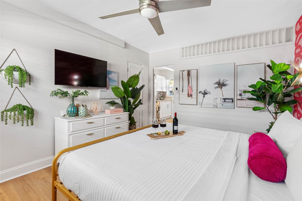 The focal point of the room is a plush king-size bed dressed in crisp, high-thread-count linens, promising a restful retreat after a day of exploring.