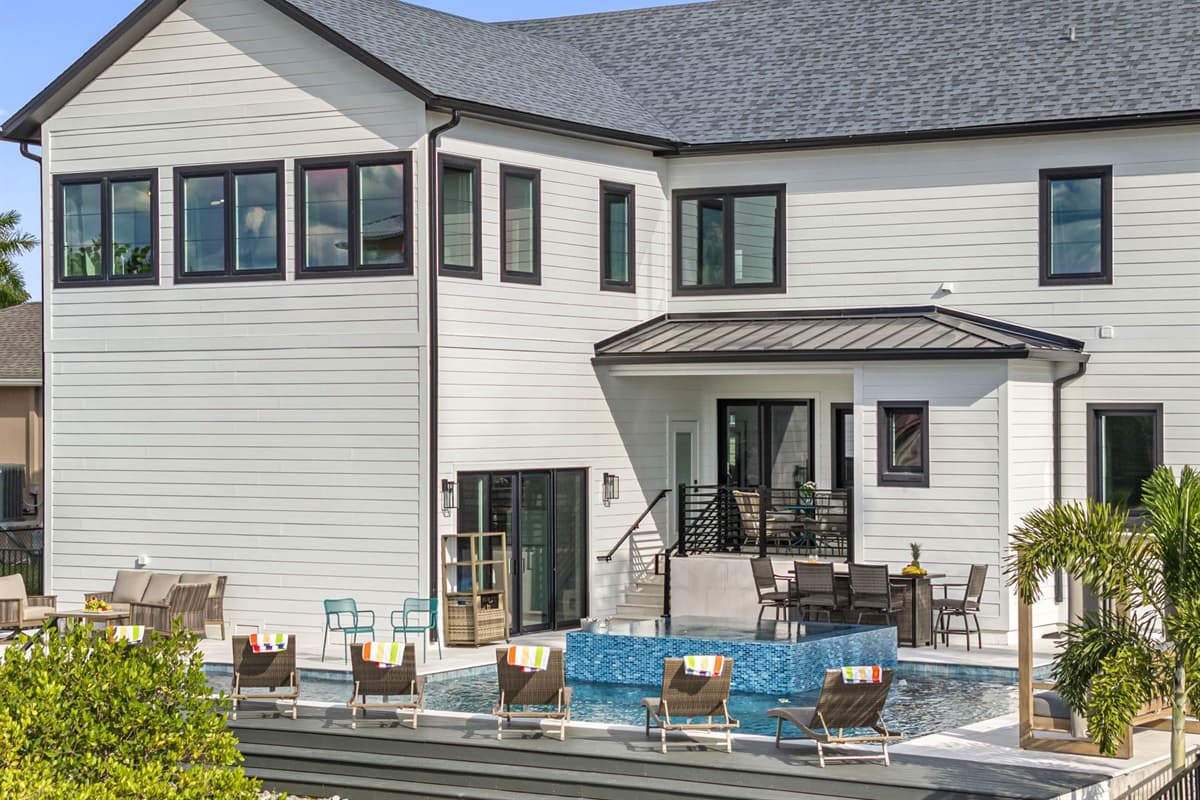 Surrounding the pool, a comfortable patio area awaits, complete with plush seating options that encourage relaxation and socialization.