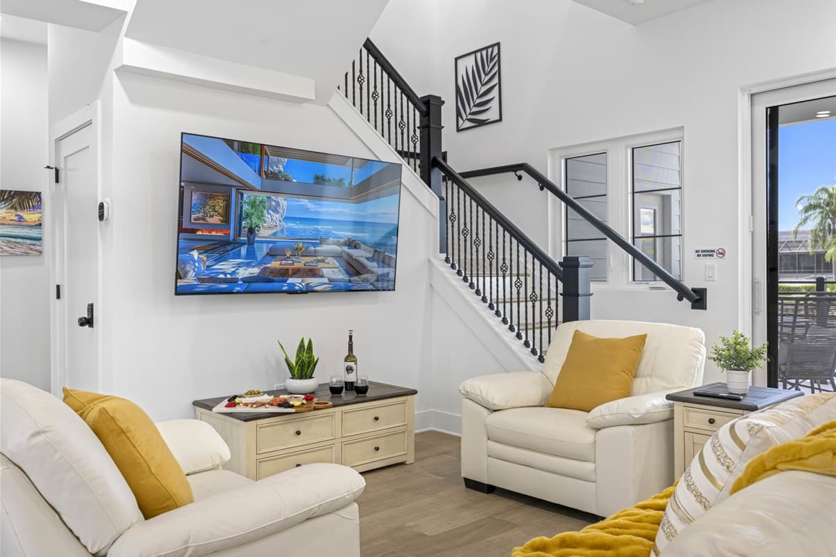 The comfortable seating arrangement, including plush sofas and armchairs, provides ample space for everyone to sit back and enjoy.