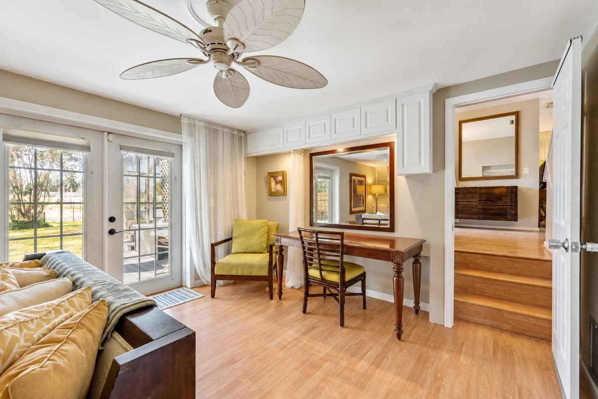 Surrounded by tasteful decor and bathed in natural light streaming in through the windows.