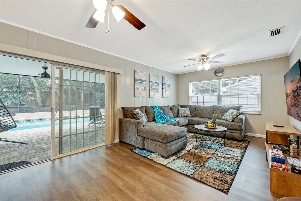 Picture yourself sinking into the plush comfort of a grey couch in the living room.