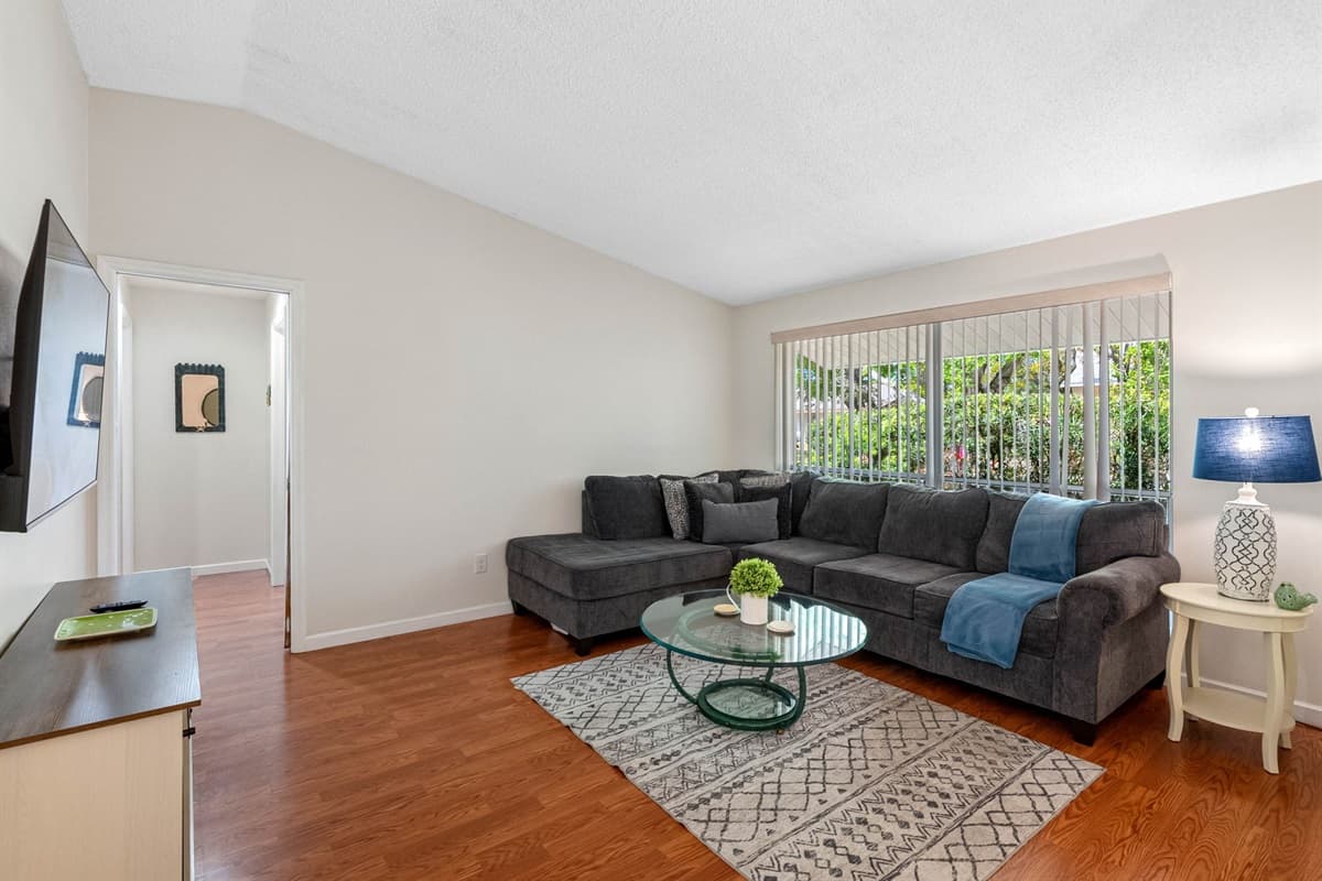 Complementing the entertainment setup is a luxurious lounging couch, crafted with high-density foam cushions that provide an ideal balance of support and softness.