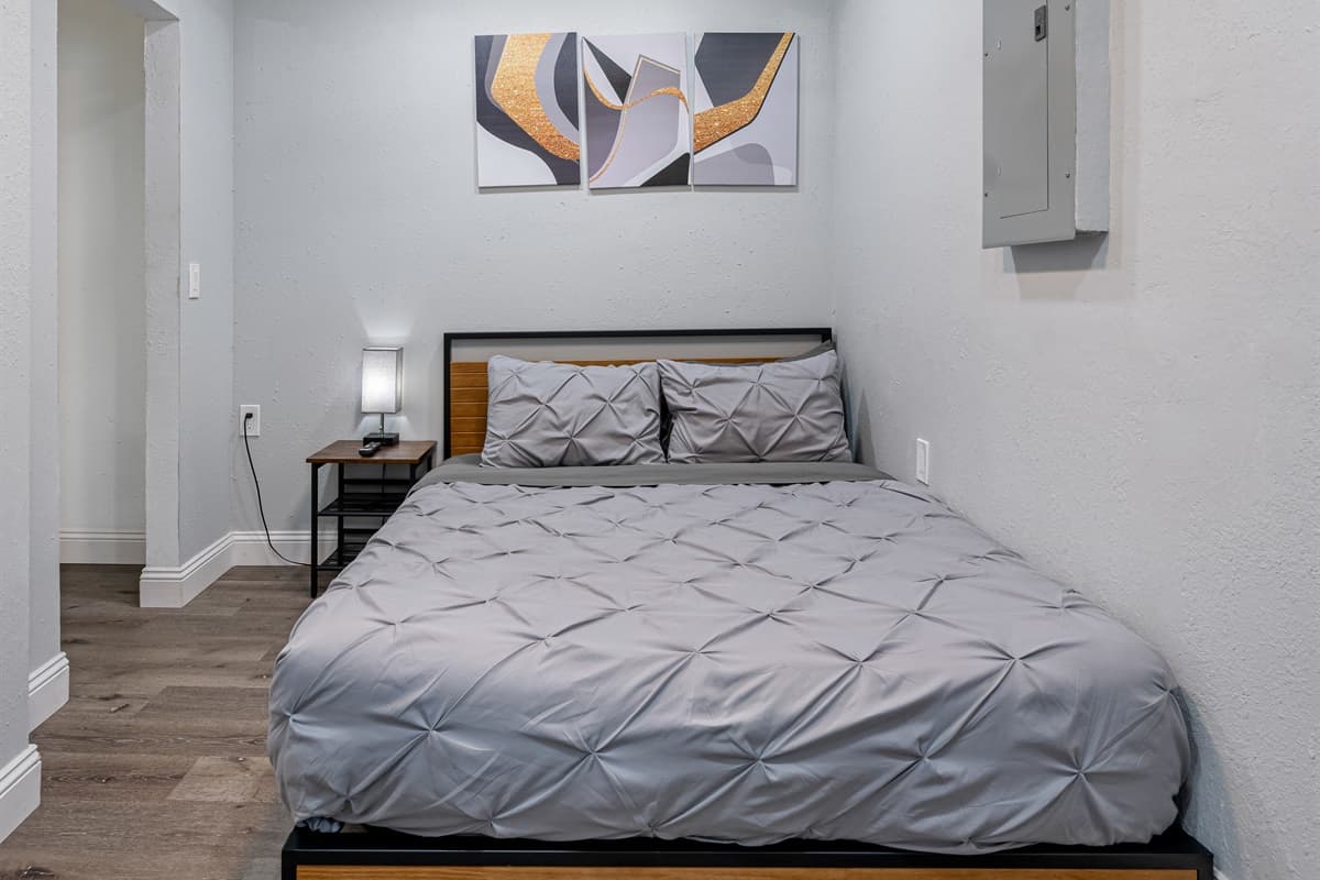 Feel comfortable and safe in this gorgeous bedroom that has a queen sized bed, drawers for storage, and its own TV! Its like sleeping in your home away from home! Book with us now!