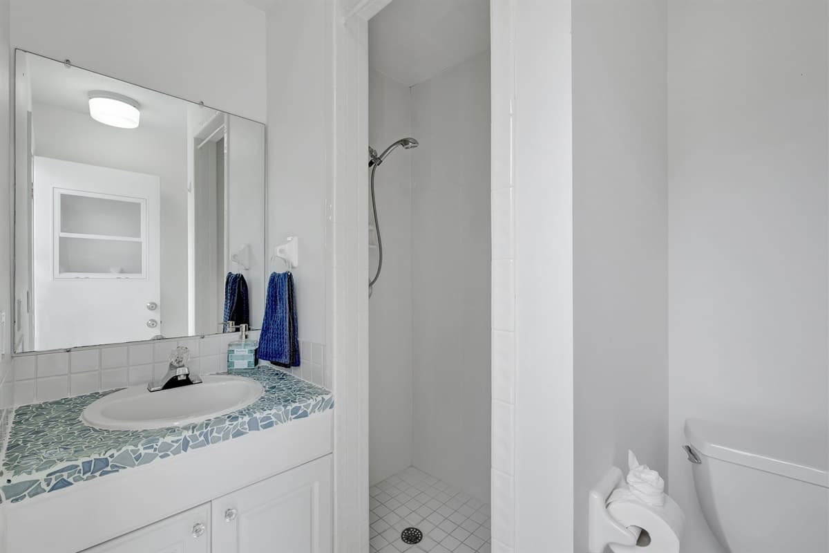 The third full bathroom can be accessed through the outside pool area.