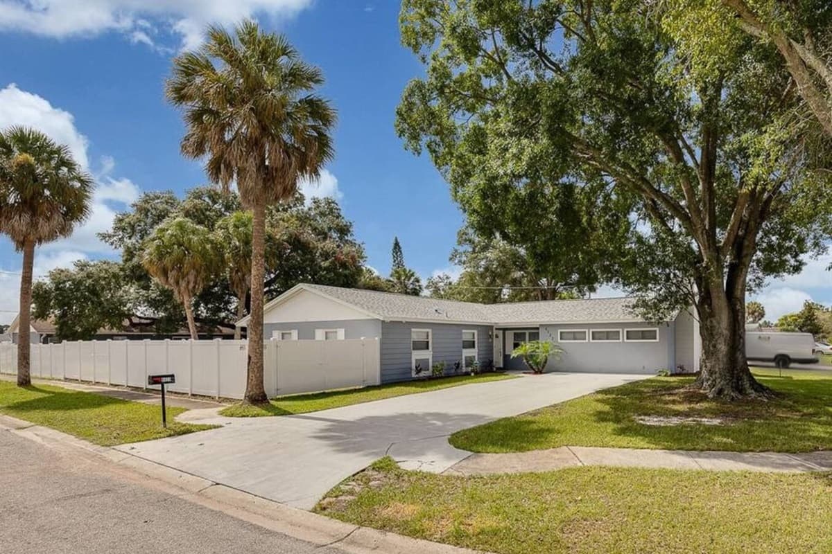 Stunning front view of the house showcasing the front yard and parking area that is equipped with CCTV cameras to ensure your safety during your stay. If you are interested in this property, send us an inquiry now!
