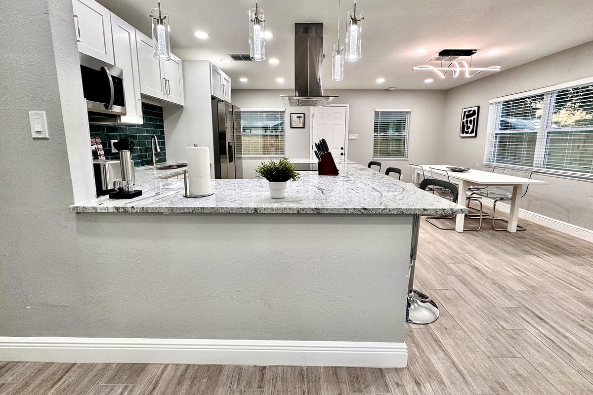 The sleek countertops provide plenty of space for meal prep, whether you're chopping fresh ingredients or assembling a delicious charcuterie board.