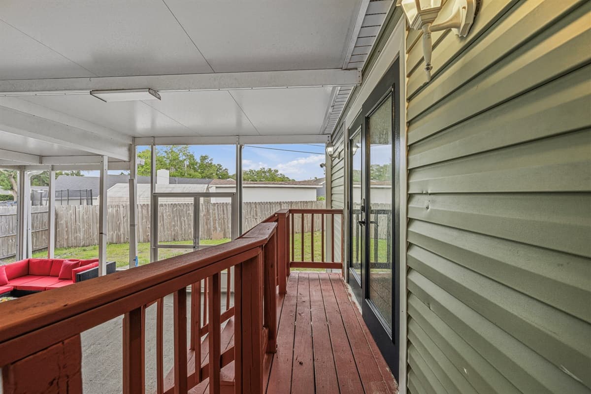 Walkway along the screened patio offering privacy and seamless indoor-outdoor flow.