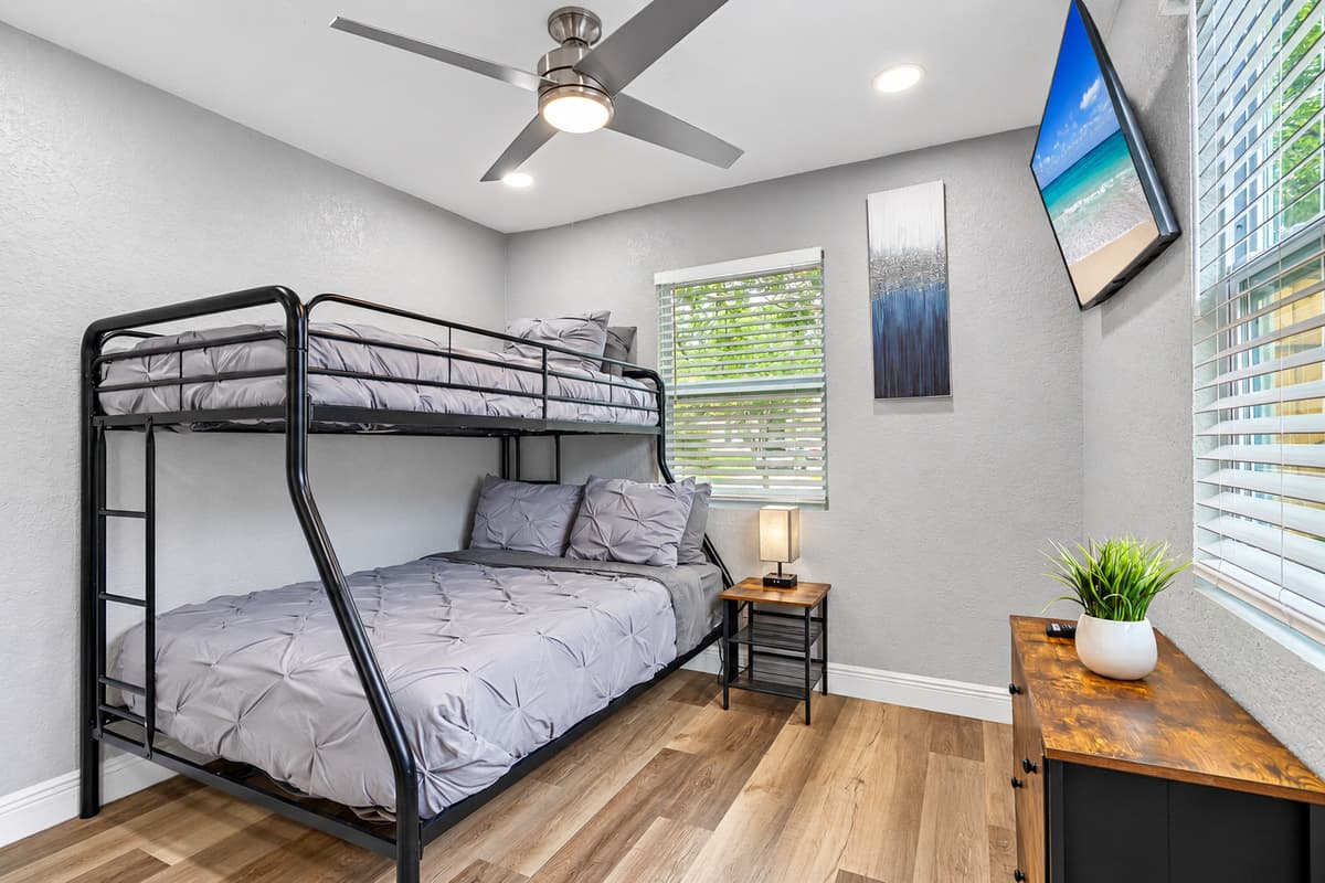 A bunk room with its own Smart TV. Bedroom 4 has a twin-over-full bunk bed, Smart TV, and a dresser. Perfect for siblings, cousins, or teens who want a space of their own.
