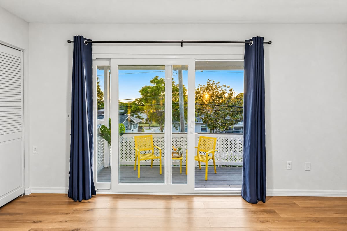 Private balcony access with seating area—perfect for morning coffee or evening relaxation 