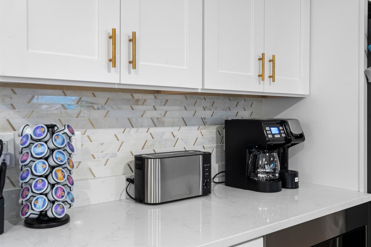 Gleaming countertops and clean lines create an elevated yet welcoming vibe.