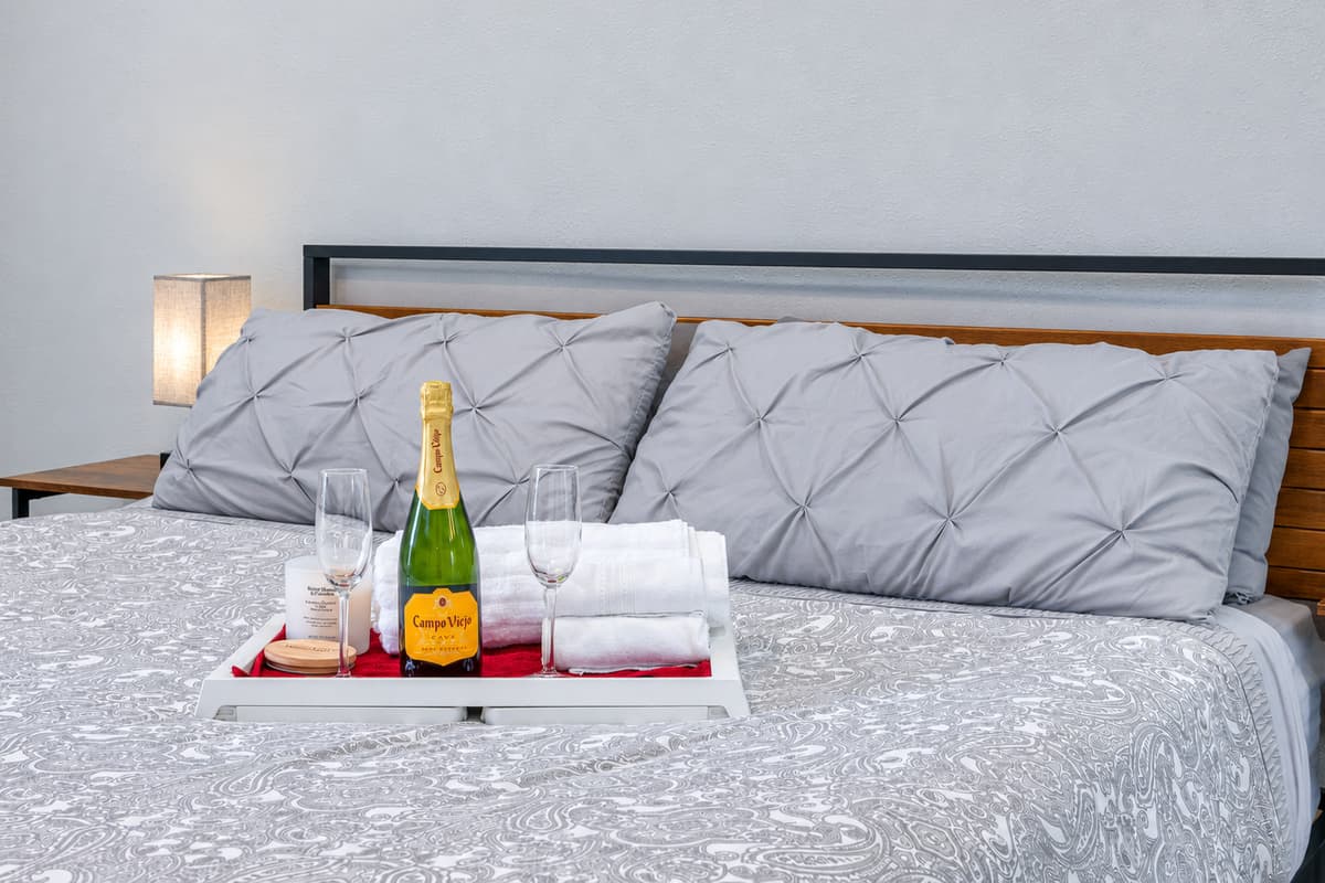 Have the best sleep during your stay in your your home away from home! This incredible bedroom has a king-sized bed, full-sized mirror closet, drawers, bed side tables and lamps, and a bathroom! Book this property now!