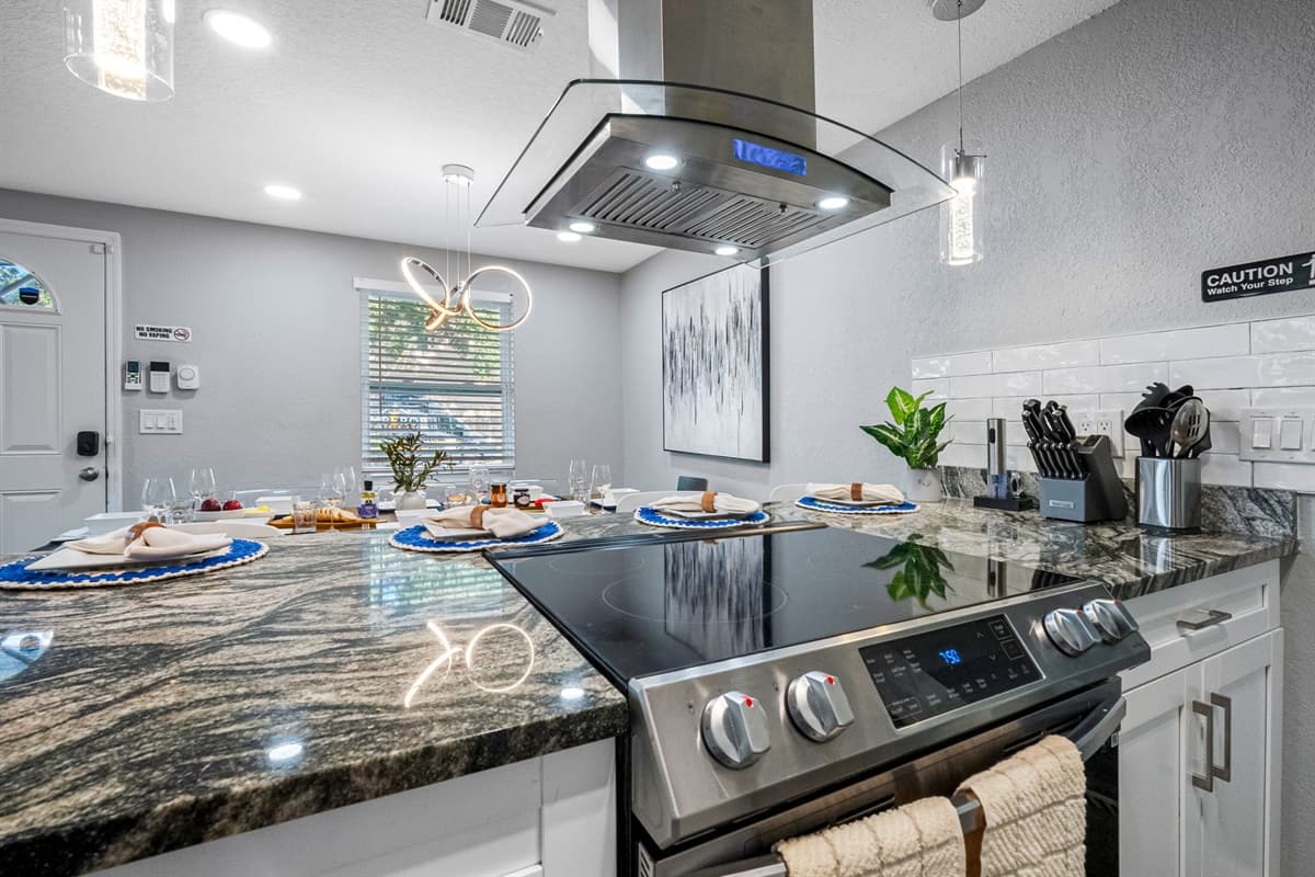 The open layout, granite counters, and stainless steel appliances blend style with convenience for a truly enjoyable stay.