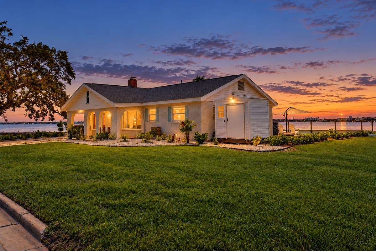 Front exterior with evening lighting.