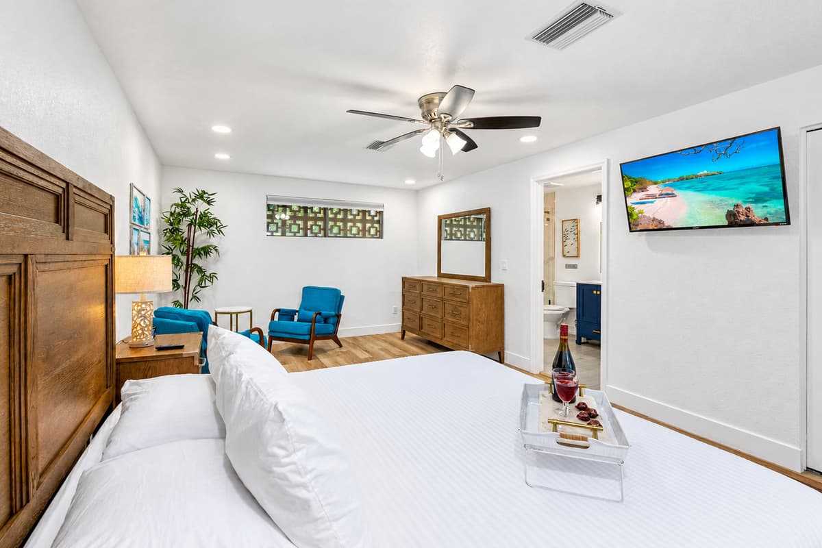 Drift off in total comfort on a cloud-soft bed in this serene, hotel-worthy bedroom—complete with modern amenities and spa-like lighting.