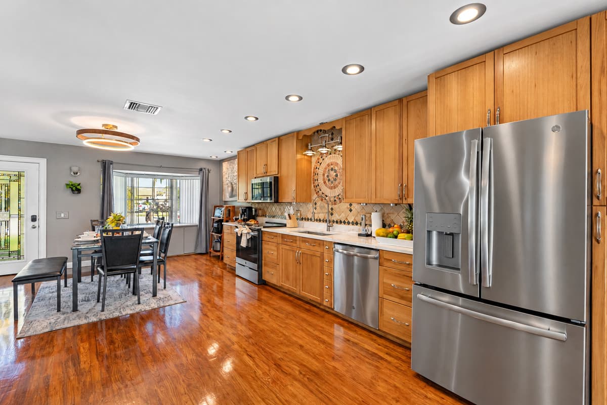 With ample cabinetry, built-in storage, and additional shelving for small appliances, this kitchen keeps everything neatly in place.