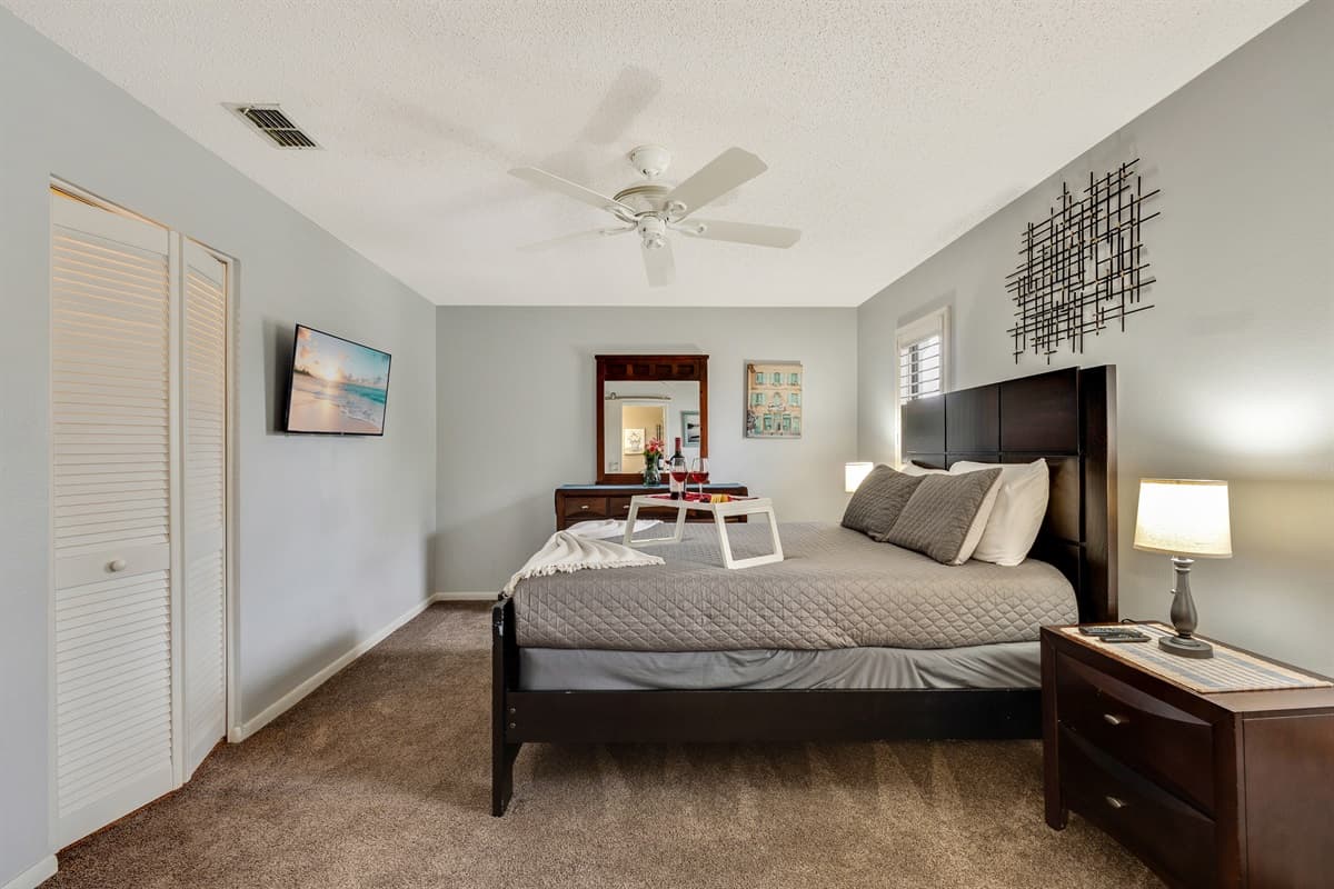 Escape to a queen size bedroom adorned with tasteful decor and soothing colors, creating a serene ambiance that envelops you in tranquility.