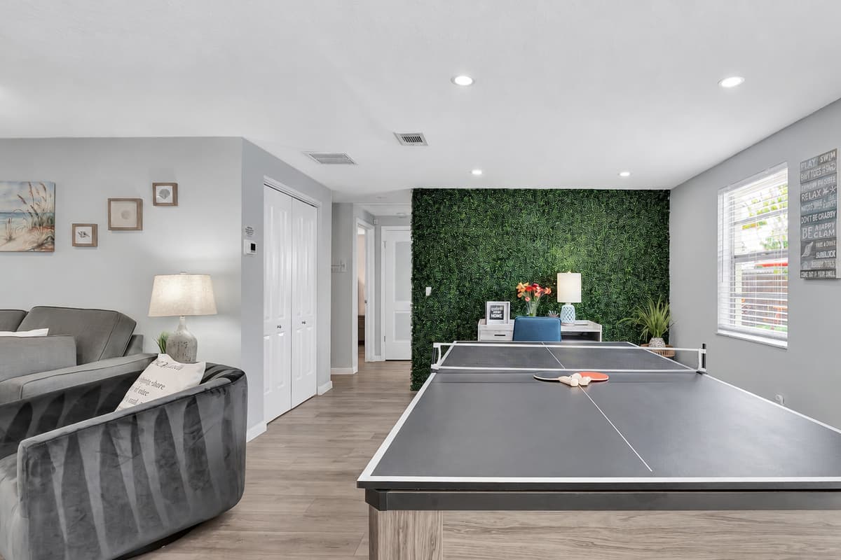 The spacious dining table, designed for eight, seamlessly morphs into your choice of a thrilling pool table or a lively pingpong table.