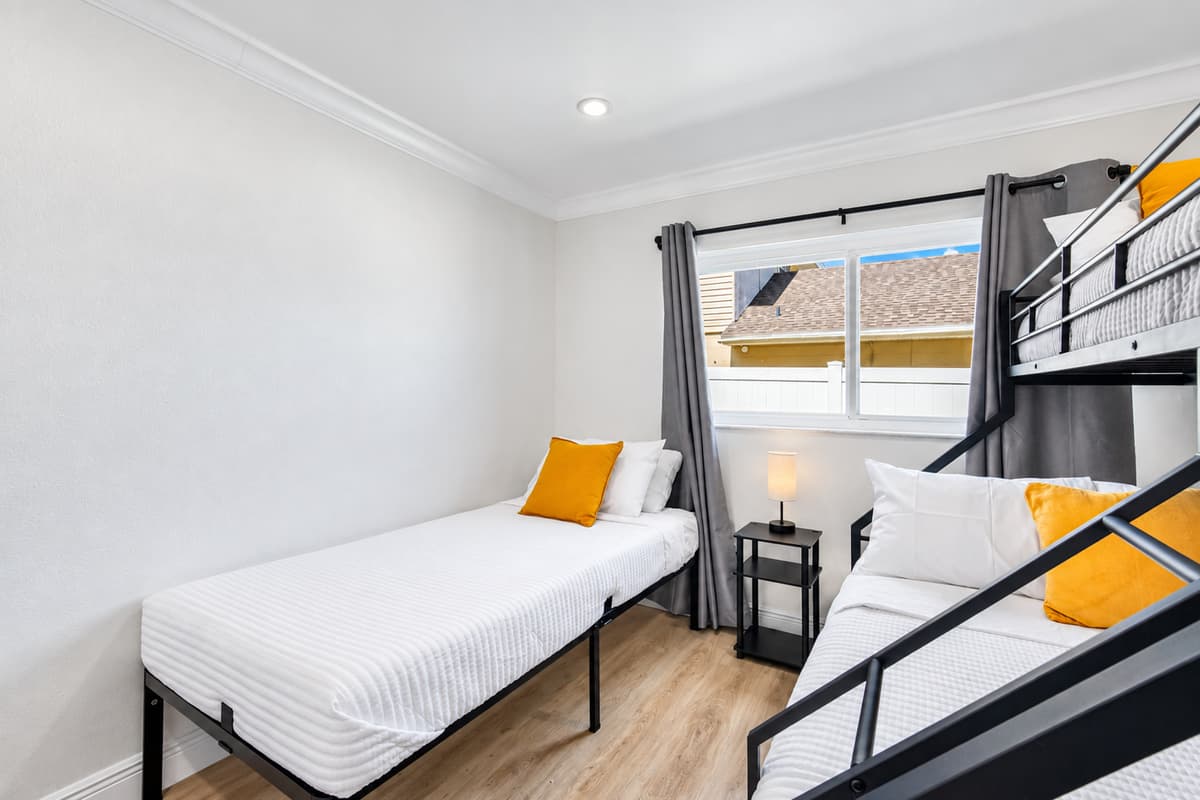 White walls, clean lines, and just the right amount of color make for a calm and modern retreat.