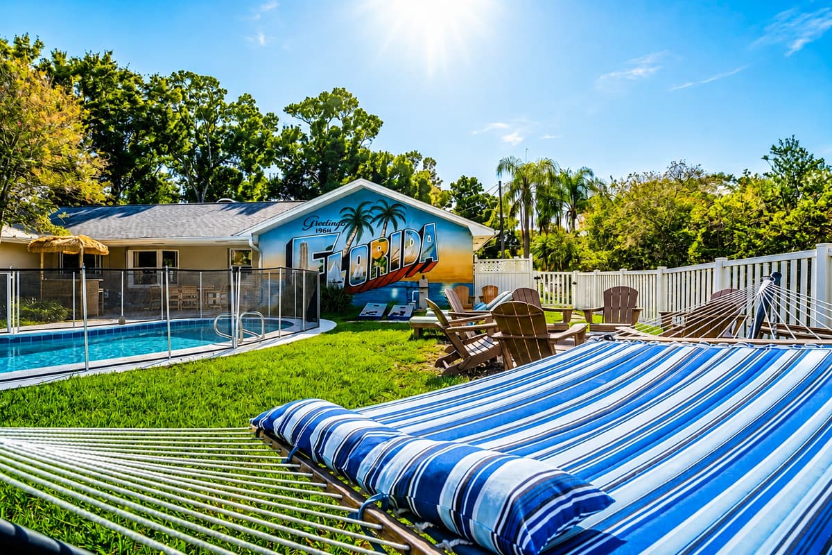 Pool, fire pit, palms, and blue sky in one frame — this is the whole reason for the trip.